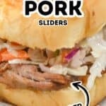 Close-up of juicy shredded pork sliders, topped with creamy coleslaw on a soft bun, featuring text labels for “Shredded Pork Sliders” and “Tender.”.