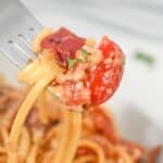 A portion of the spaghetti meal on a fork.