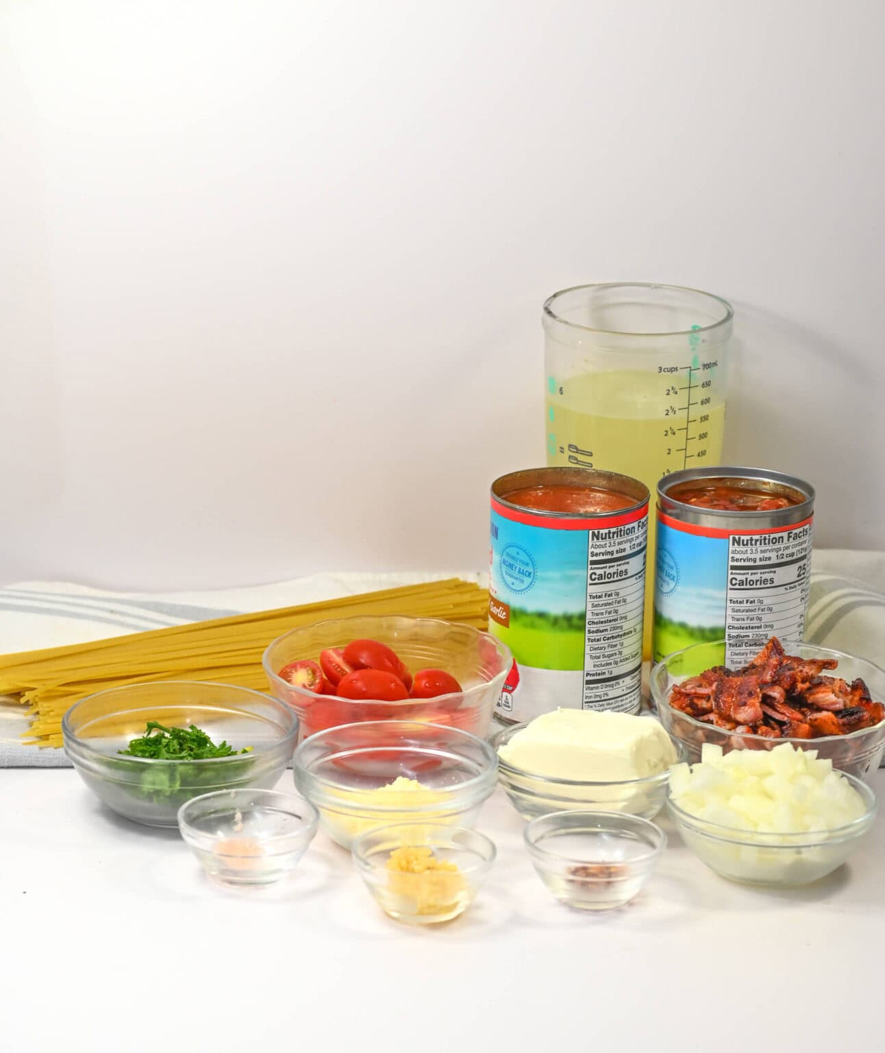 Linguini, canned goods and herbs need for the dish.