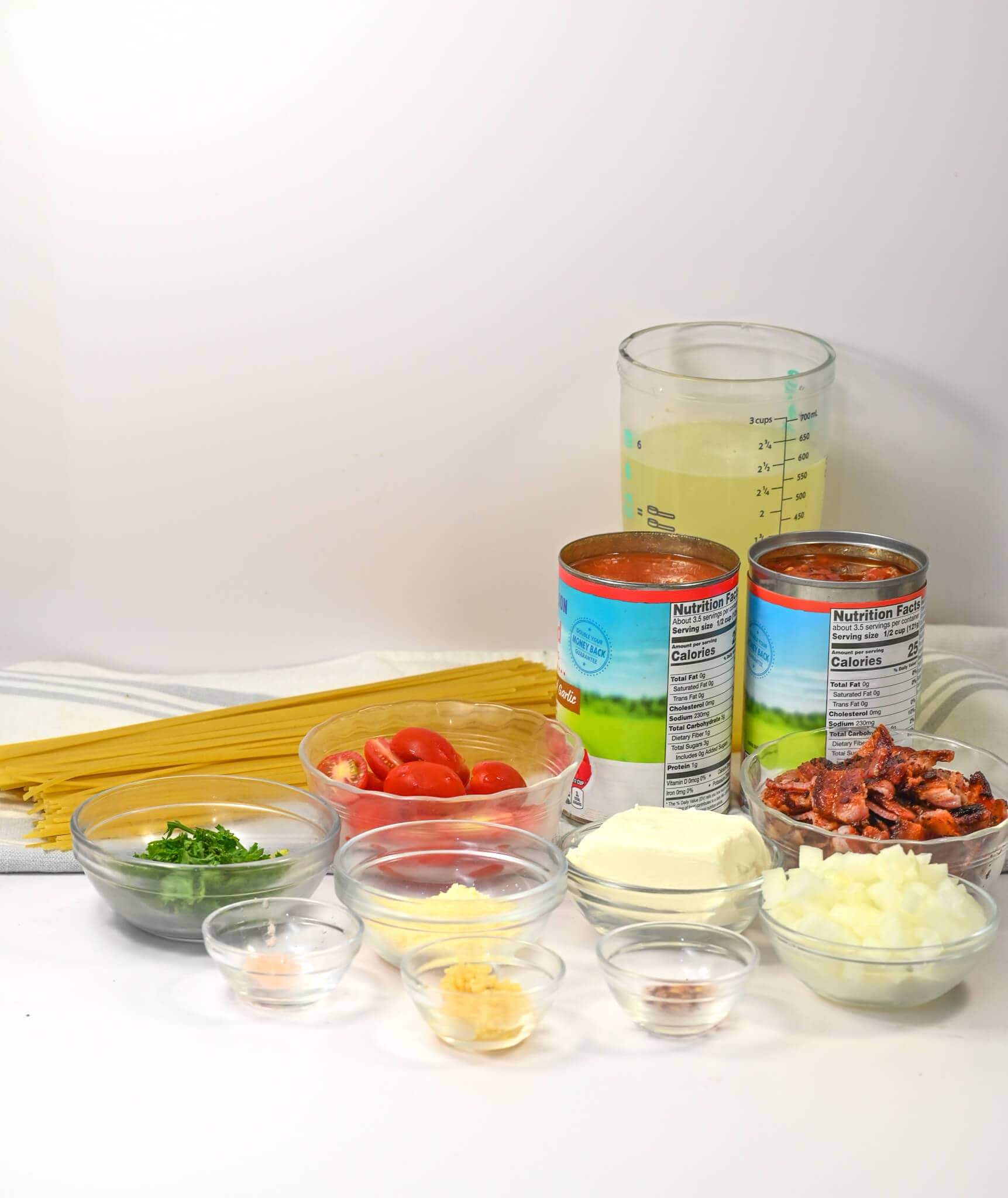 Linguini, canned goods and herbs need for the dish.