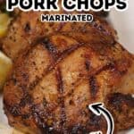 Close-up of marinated grilled pork chops with beautiful grill marks, served on a white plate. Text on image reads “Grilled Pork Chops Marinated Quick.” Featuring a flavorful Grilled Pork Chops Marinade, these chops are juicy, tender, and perfect for a quick meal.