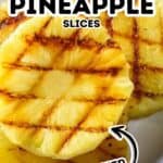 Three Grilled Pineapple Slices with visible grill marks rest on a white plate. Text reads “Grilled Pineapple Slices Glazed.”.