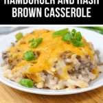 A plate of savory goodness, this hamburger and hash brown casserole is topped with melted cheese and green onions, all elegantly presented on a wooden board.