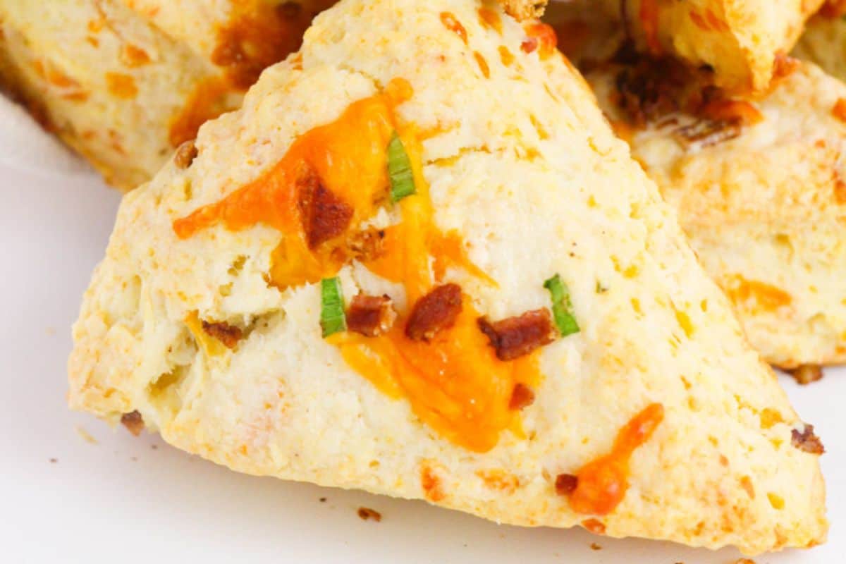 A bacon cheddar scone on a plate.