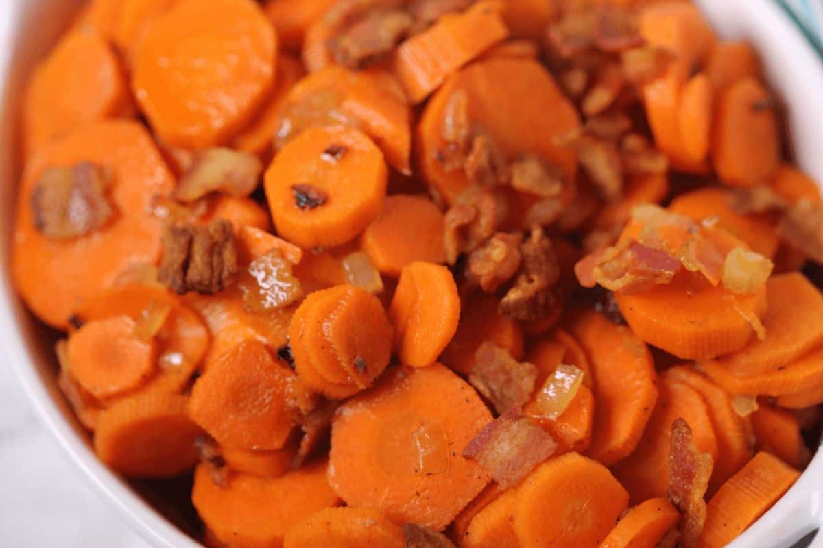 A bowl full of brown sugar bacon carrots.