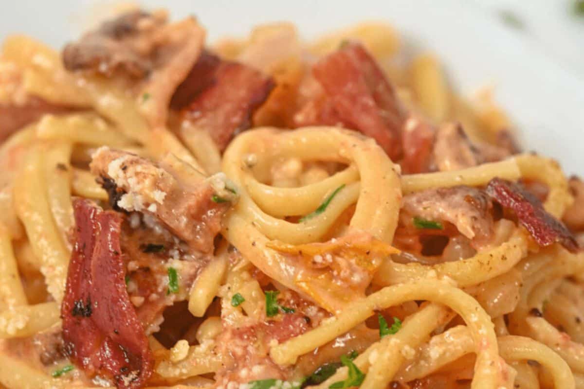 Creamy bacon pasta on a dish.