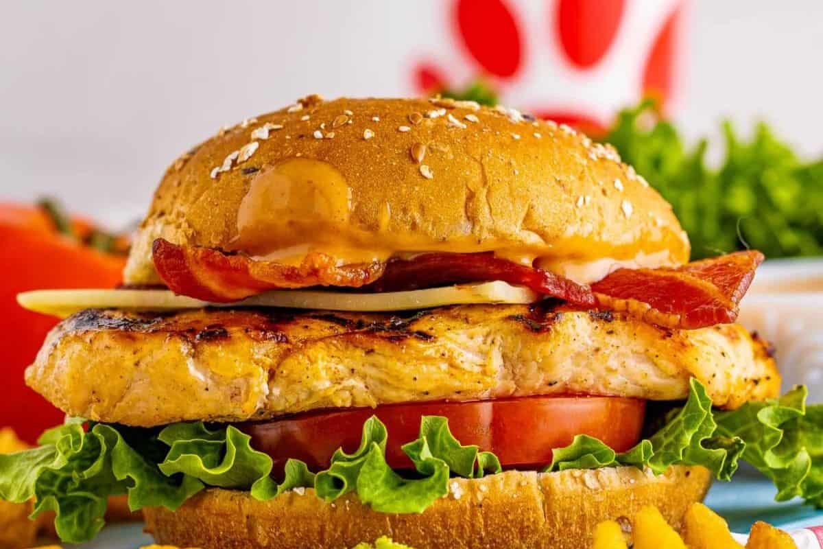 Try a grilled chicken sandwich with lettuce, tomato, bacon, cheese, and sauce on a sesame bun. Perfect for those who want to recreate Chick-fil-A recipes at home!