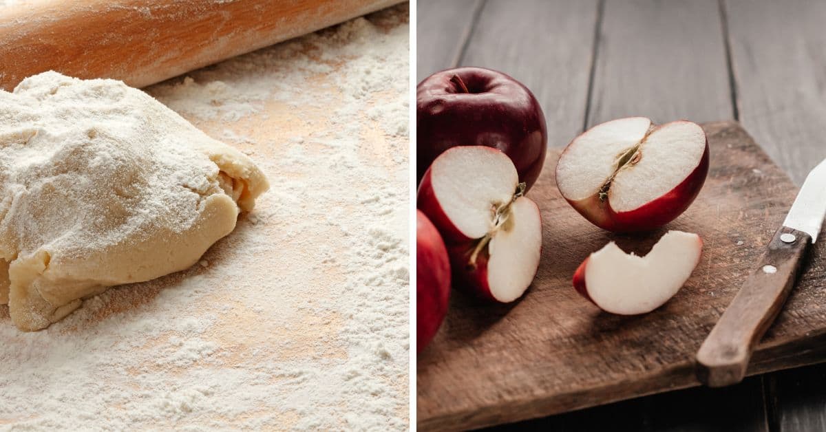 A mound of dough with a rolling pin on a floured surface sits next to sliced red apples and a knife on a wooden board.
