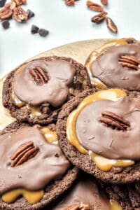 Caramel and Nut turtle cookies on a platter.