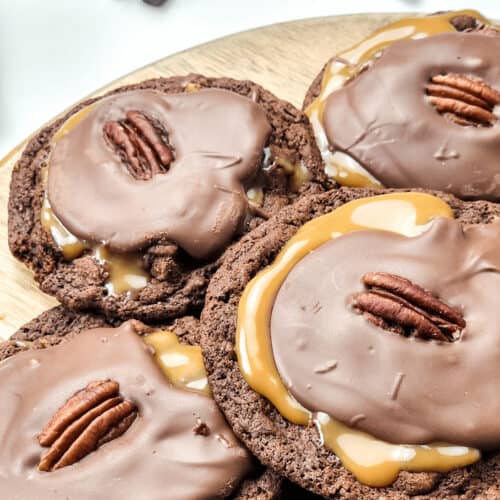 Caramel and Nut turtle cookies on a platter.