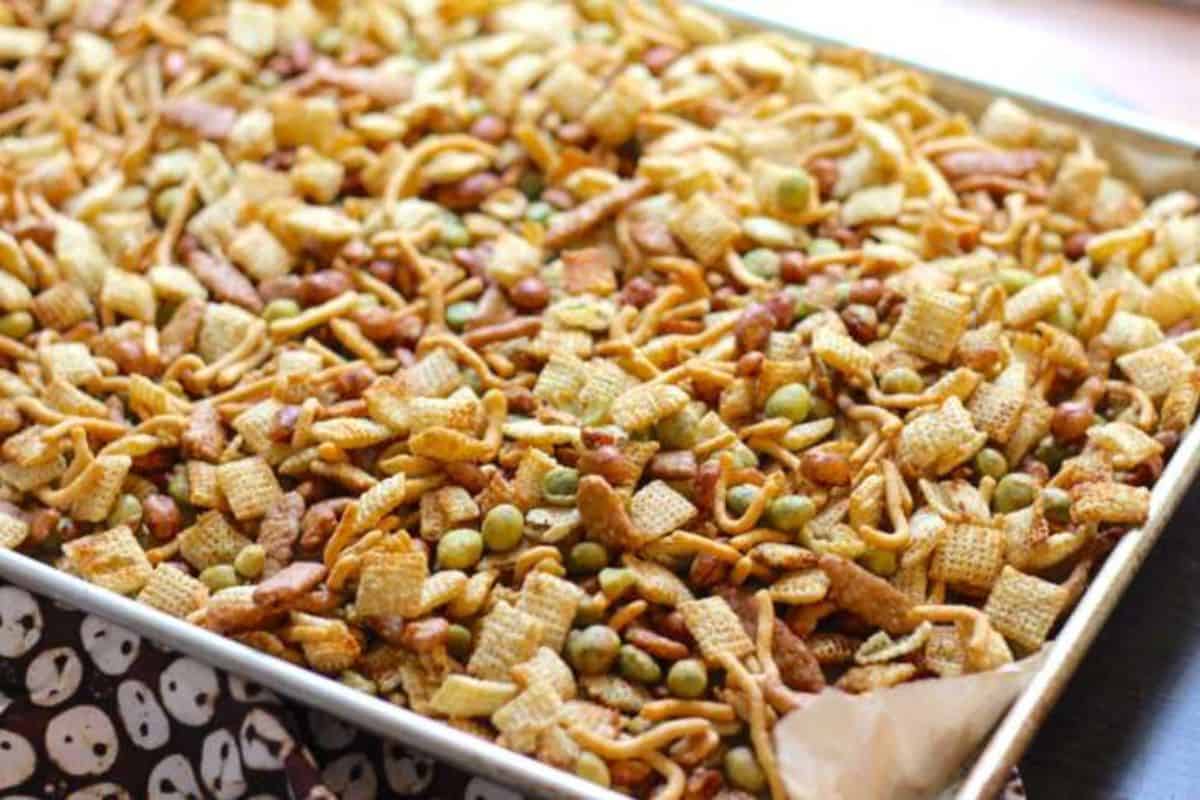A baking tray brimming with Asian style snack mix.
