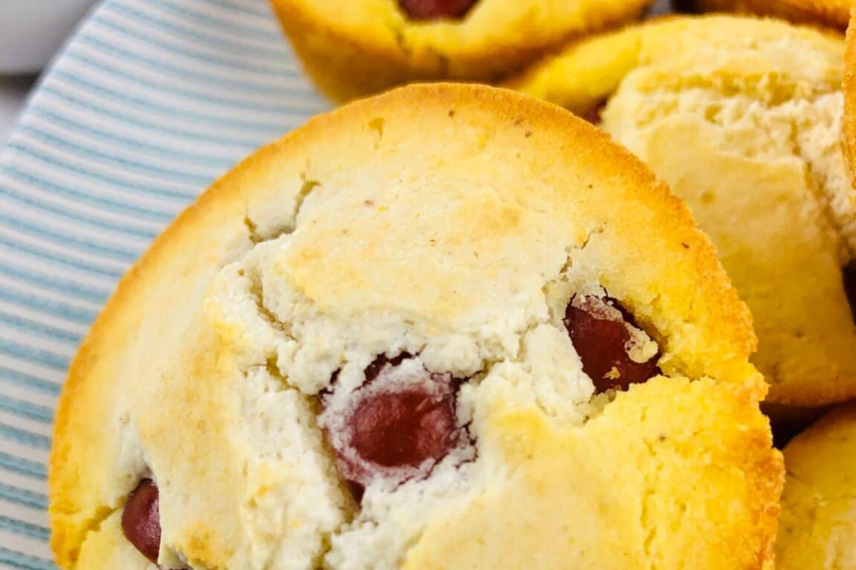 Close-up of corn dog muffins on a blue and white serving dish.