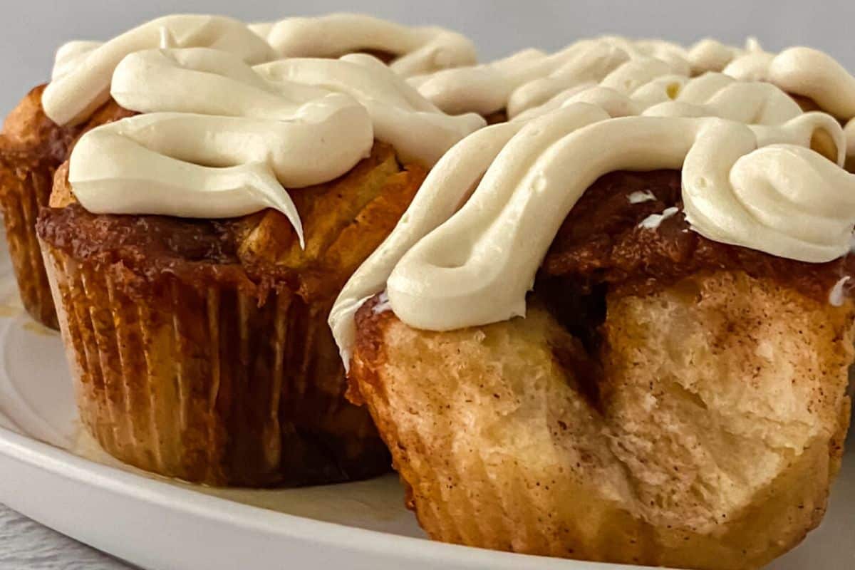 Pumpkin monkey bread muffins on a white serving dish.