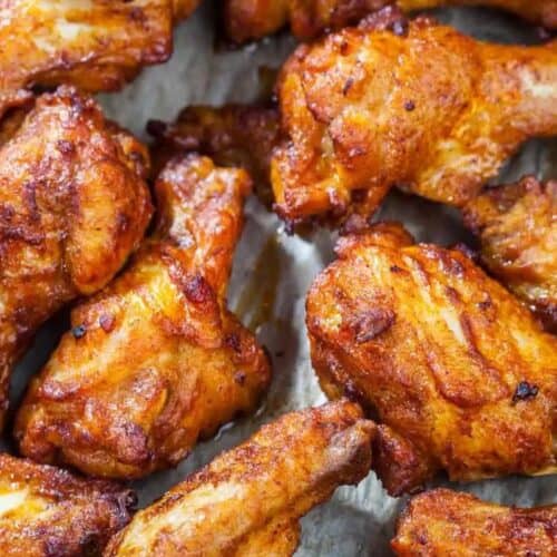 Close-up of cooked, crispy chicken wings with a golden-brown texture.
