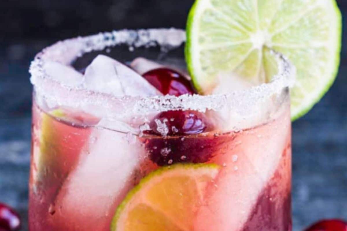 A glass of festive Christmas margarita recipe with a salted rim.