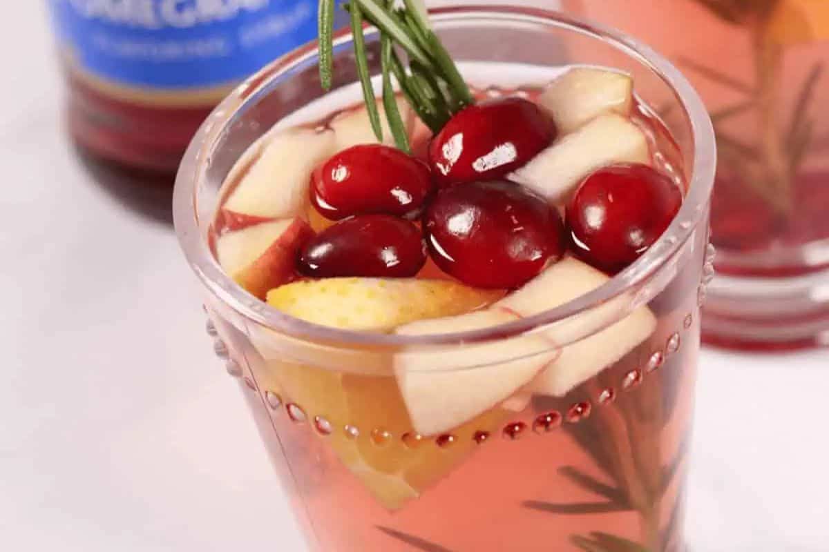 Close-up of a glass filled with Christmas sangria.