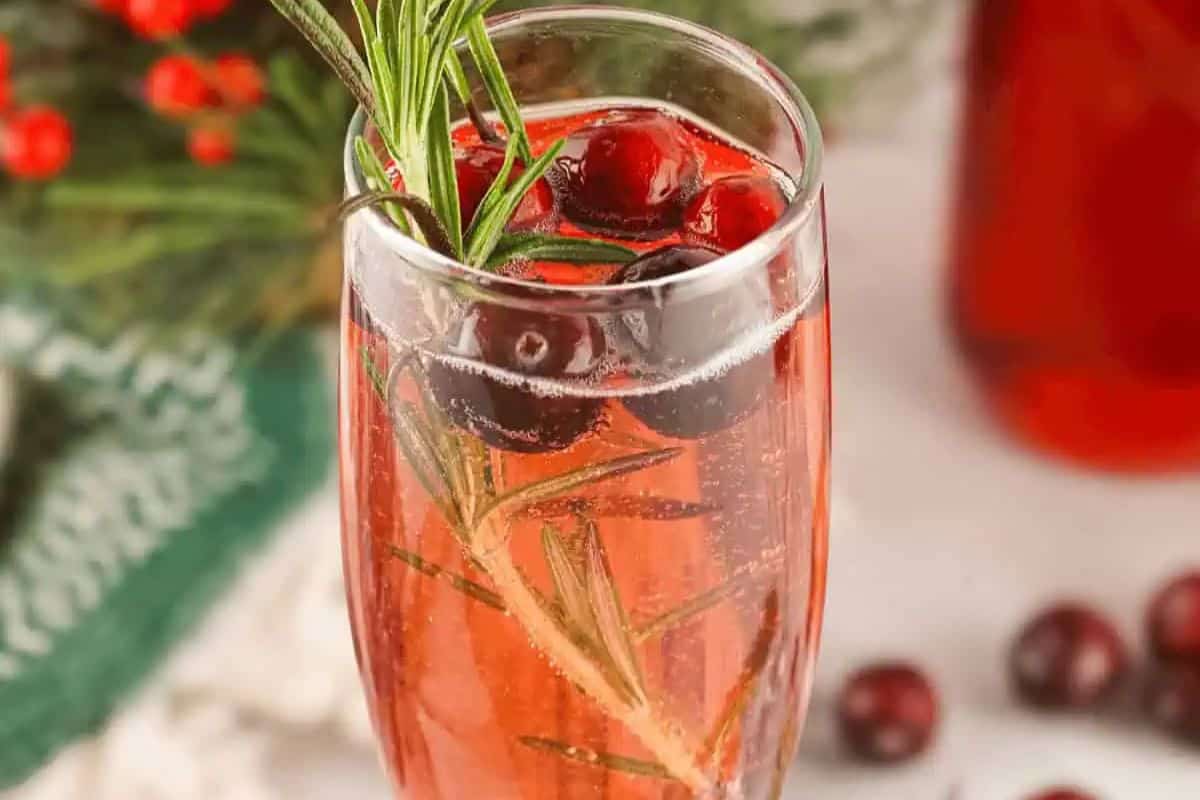 A glass of cranberry mimosa.