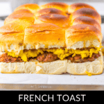 Indulge in breakfast sliders featuring French toast, fluffy scrambled eggs, and savory sausage, all perfectly arranged on a baking sheet.