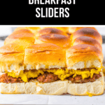 A tray of delightful breakfast sliders awaits, featuring scrambled eggs and sausage cozily nestled between fluffy French toast buns.