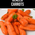 A white plate of maple-glazed carrots is elegantly garnished with fresh parsley.
