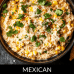 A vibrant bowl of Mexican Street Corn Dip, topped with fresh cilantro and a generous sprinkle of cheese, waits invitingly amidst a sea of crispy tortilla chips.