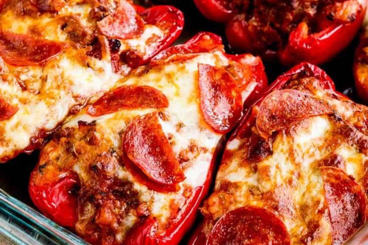 Baked red bell peppers stuffed with melted cheese, ground meat, and topped with pepperoni slices make easy stuffed peppers perfect for weeknight dinners.
