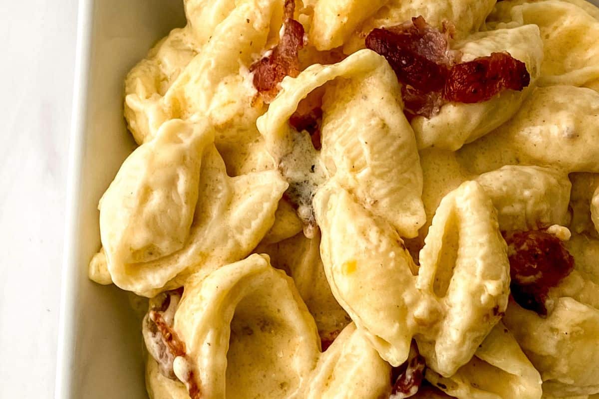 Smoked bacon mac and cheese in a white bowl.