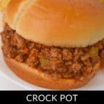 A close-up of a mouthwatering Crock Pot Sloppy Joe sandwich with a savory meat filling on a bun. The text reads, "Crock Pot Sloppy Joes.