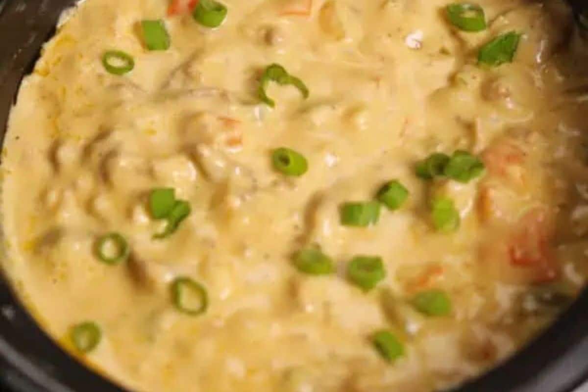 Score big points with this creamy soup featuring chunks of vegetables, perfectly topped with sliced green onions. A twist on irresistible dips, it's a Super Bowl favorite that's sure to impress!.
