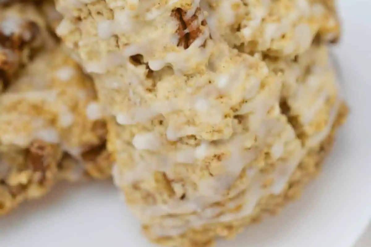 Close-up of a cinnamon scone with a textured surface, perfect for a festive St. Patrick's Day brunch, placed on a white plate.