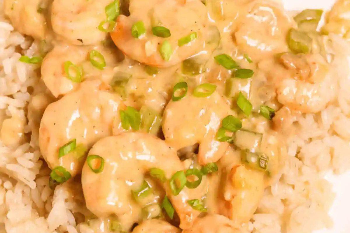 Restaurant quality creamy shrimp sauce with chopped green onions over a bed of rice.