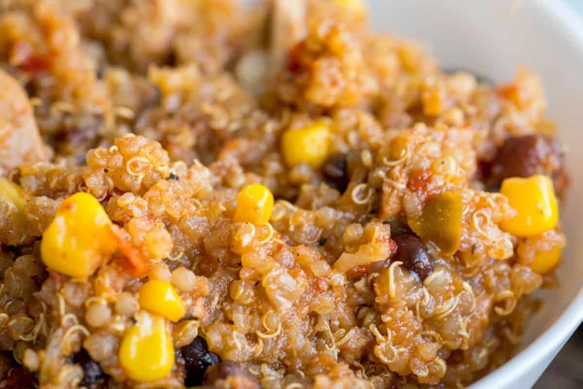 A close-up of a quinoa dish mixed with black beans, corn, diced tomatoes, and spices in a white bowl—one of the easy Weight Watchers recipes perfect for a healthy and satisfying meal.