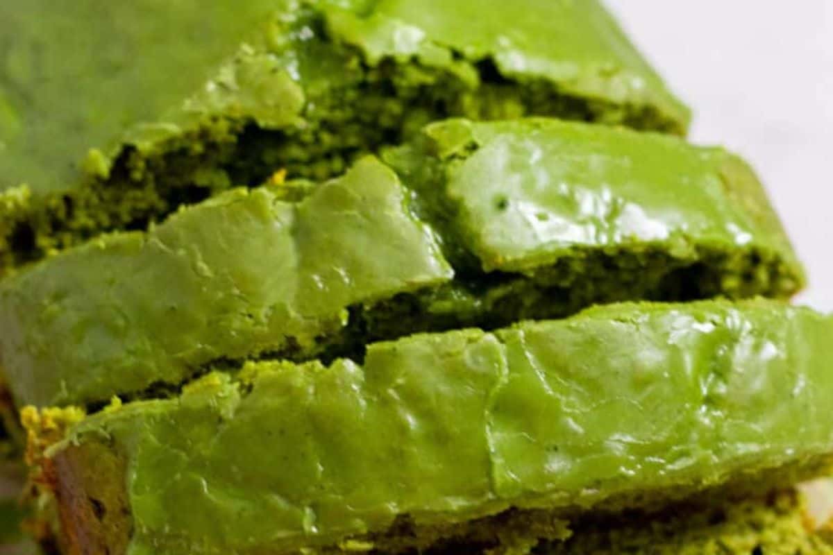 Close-up of cute, shiny green bread slices on a white background, perfect for adding a festive touch to your St. Patrick's Day celebration.