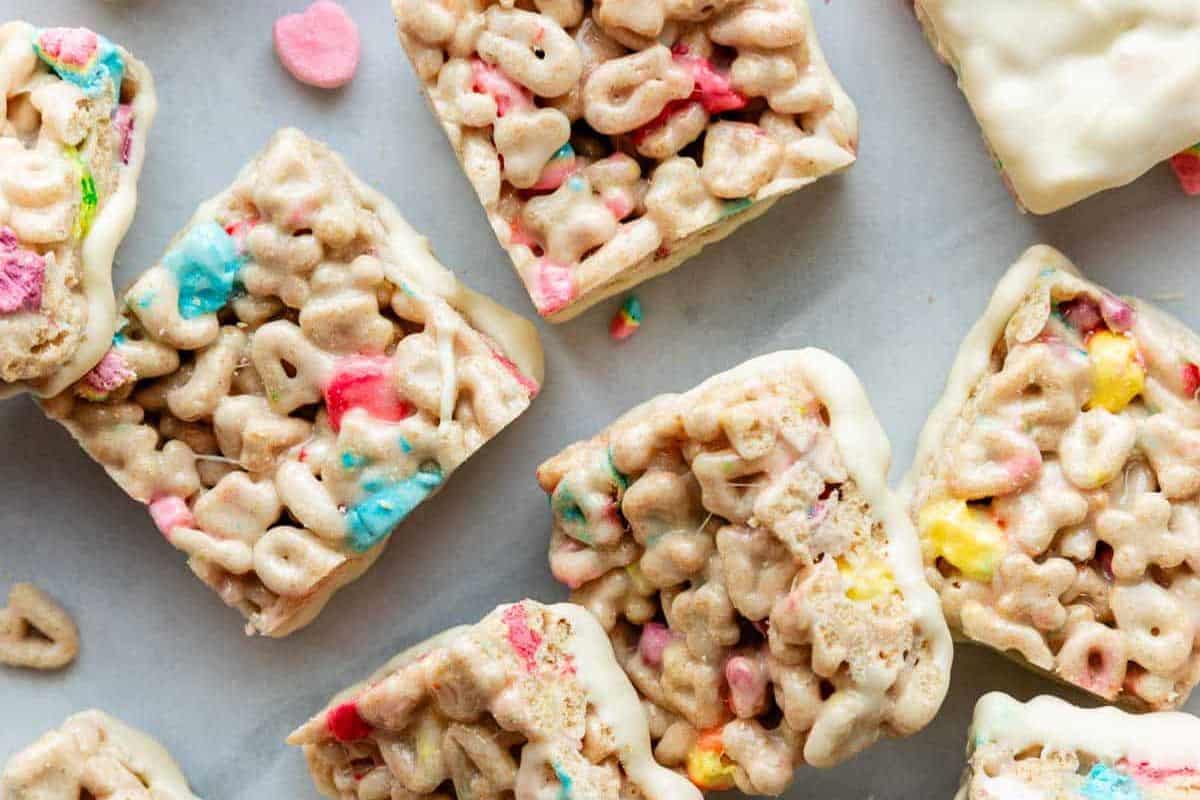 Cute cereal bars with colorful marshmallow bits rest invitingly on a light surface, perfect for celebrating St. Patrick’s Day sweets.