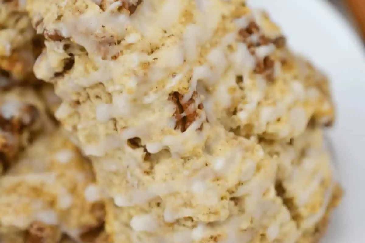 A delightful close-up of crumbly, brownish baked goods with a white icing drizzle on top, perfect for your spring brunch recipes.