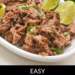 Plate of flavorful Mexican shredded beef garnished with lime wedges and cilantro on a white dish. Text at bottom: "Easy Slow Cooker Delight.