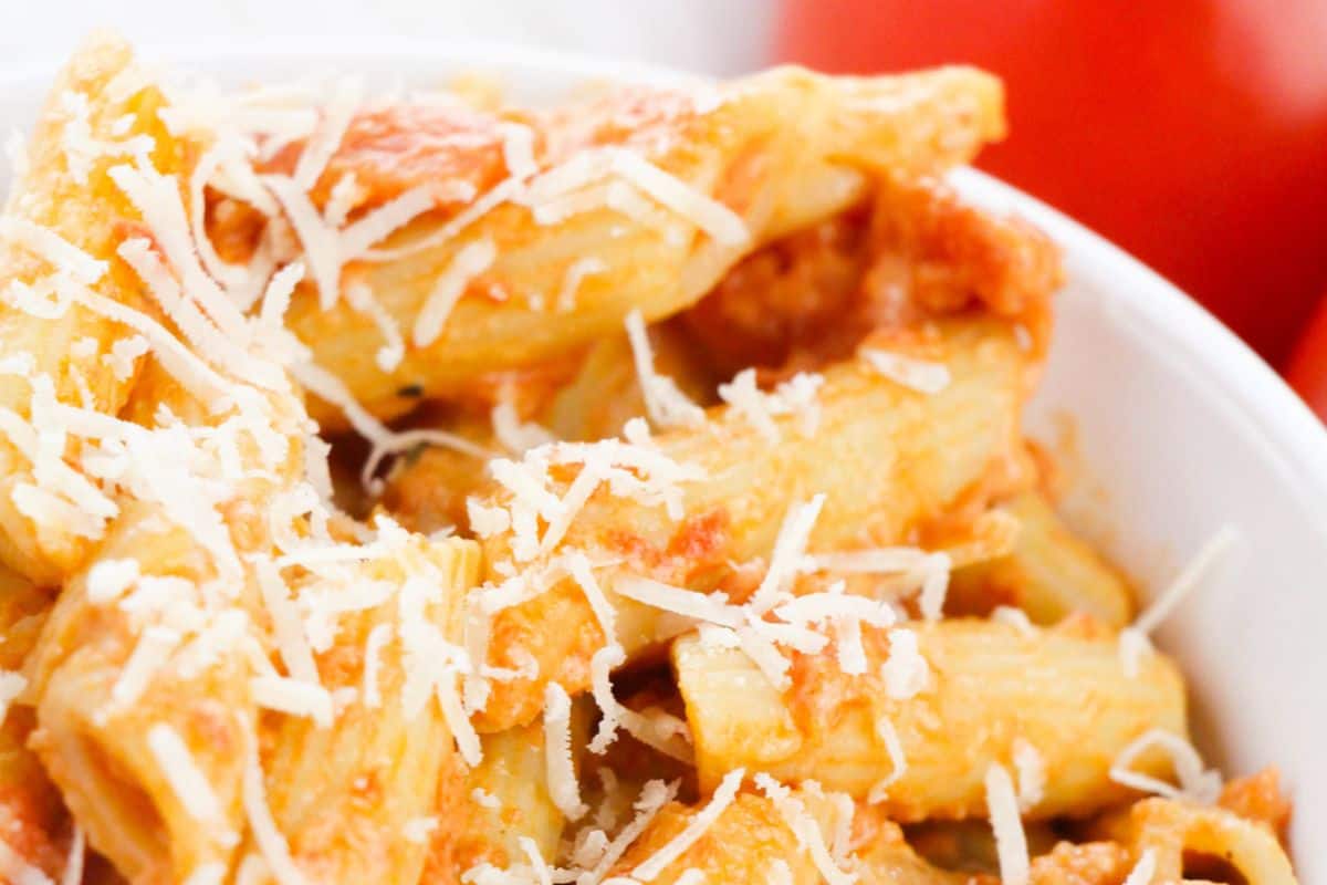 A classic Italian-American dish featuring penne pasta coated in a creamy, rich vodka tomato sauce. The dish is finished with freshly grated Parmesan for an extra touch of indulgence.