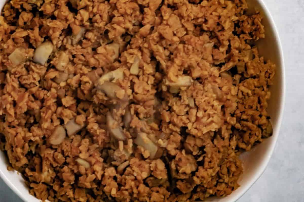 A close-up view of a bowl filled with cooked, crumbled soy protein and mushroom pieces—perfect for meatless recipes during Lent.