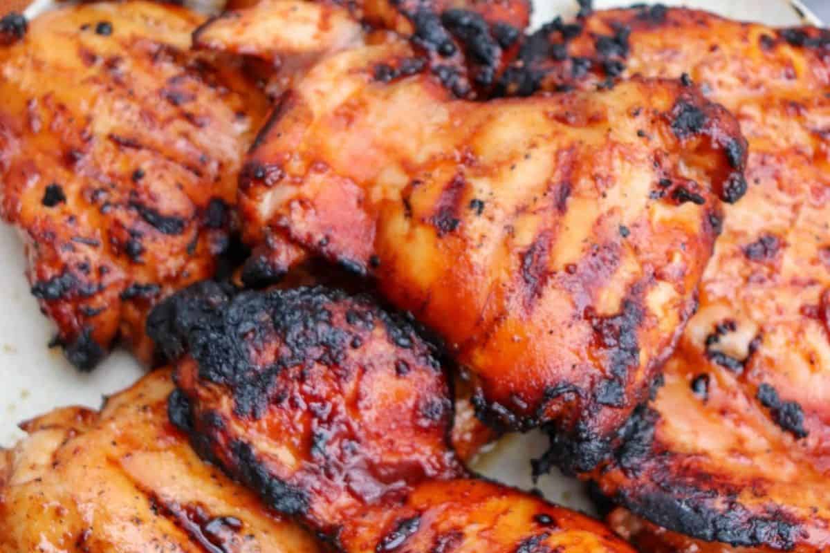 Juicy chicken thighs with visible char marks and a glazed, caramelized surface—perfect for anyone who loves flavorful chicken thigh recipes.