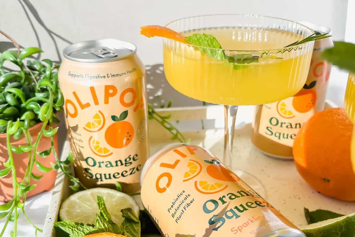 A Bahama Mama cocktail, likely made with Olipop Orange Squeeze.