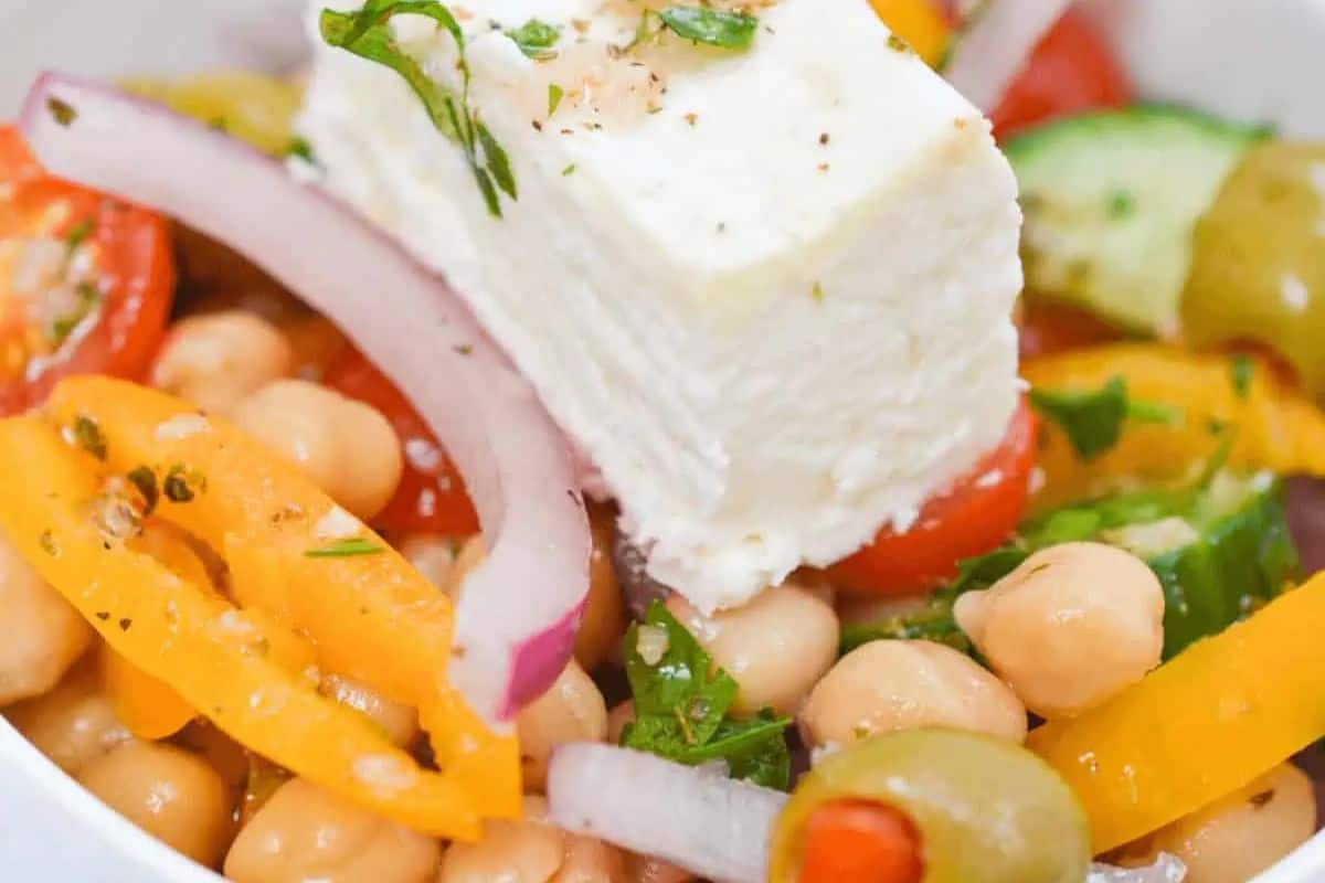 Greek Chickpea Salad, a refreshing and healthy salad with chickpeas, feta cheese, and various colorful vegetables. 
