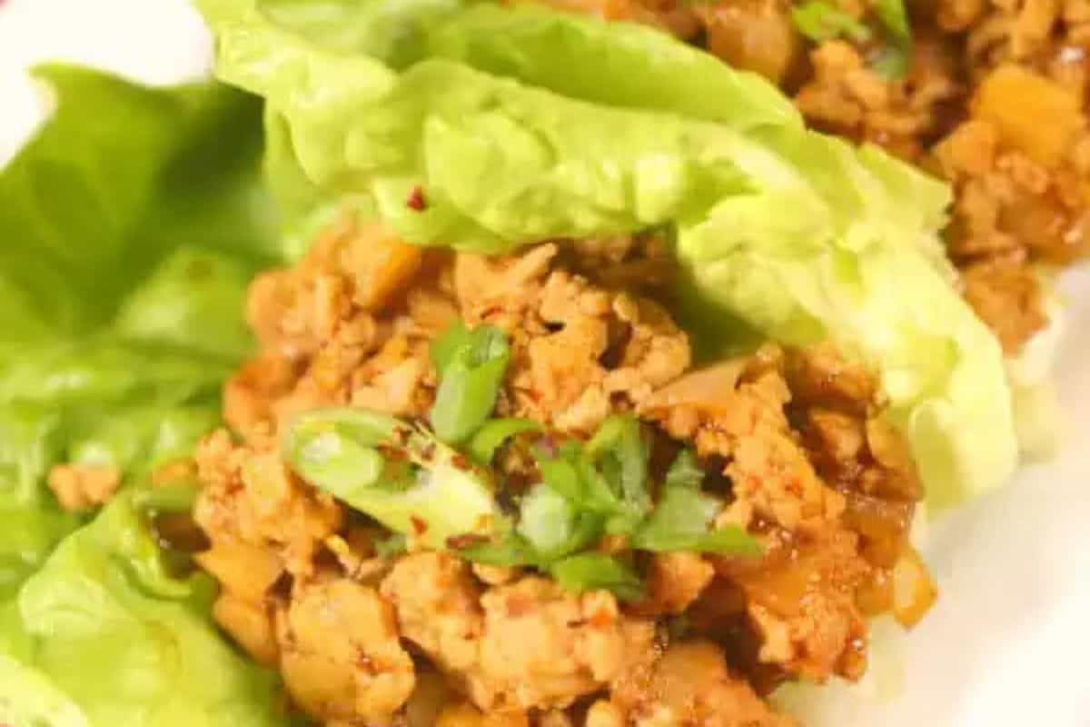 Enjoy these restaurant-inspired lettuce wraps filled with seasoned minced meat and garnished with chopped green onions. Perfect for those who love to make at home dishes that bring a taste of dining out right to your table.