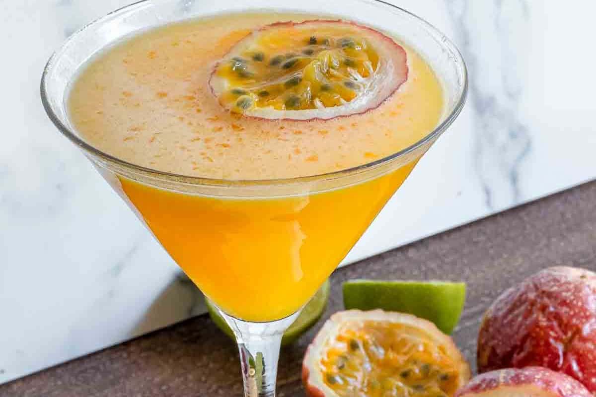 A Passion Fruit Martini featuring passion fruit, vodka, and lime.