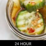 A jar filled with sliced cucumbers, onions, and spices in brine, labeled as 24 hour Refrigerator Bread and Butter Pickles.