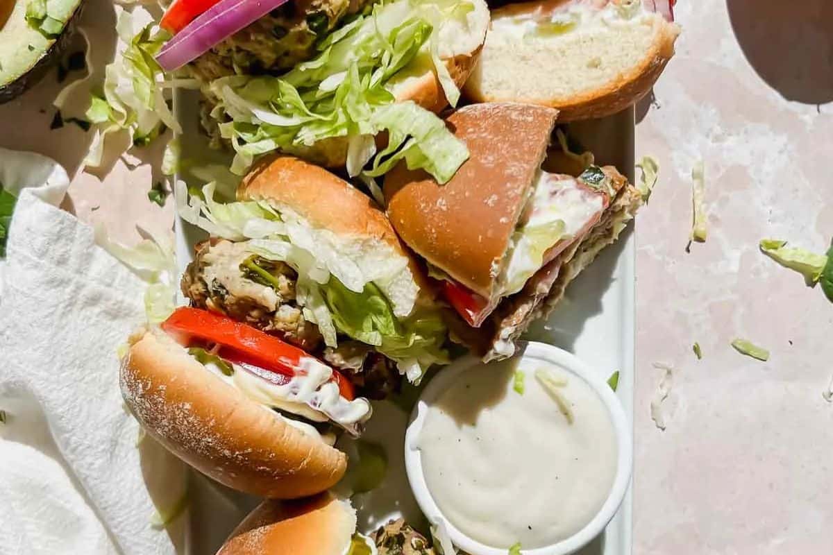 Spinach Feta Turkey Burgers featuring ground turkey, spinach, and feta cheese, served on buns.