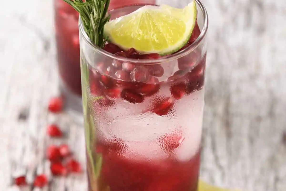 A Vodka Cranberry Cocktail featuring vodka, cranberry juice, lime, and rosemary.