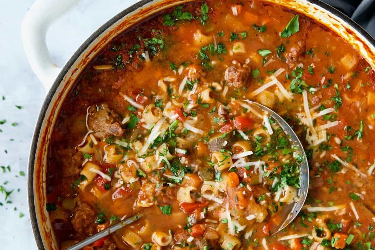 This hearty soup is brimming with chunks of spicy sausage, whole grain pasta, and colorful vegetables in a rich, tomato-based broth. Finished with shredded cheese and fresh herbs, it's a soul-warming bowl perfect for chilly days.