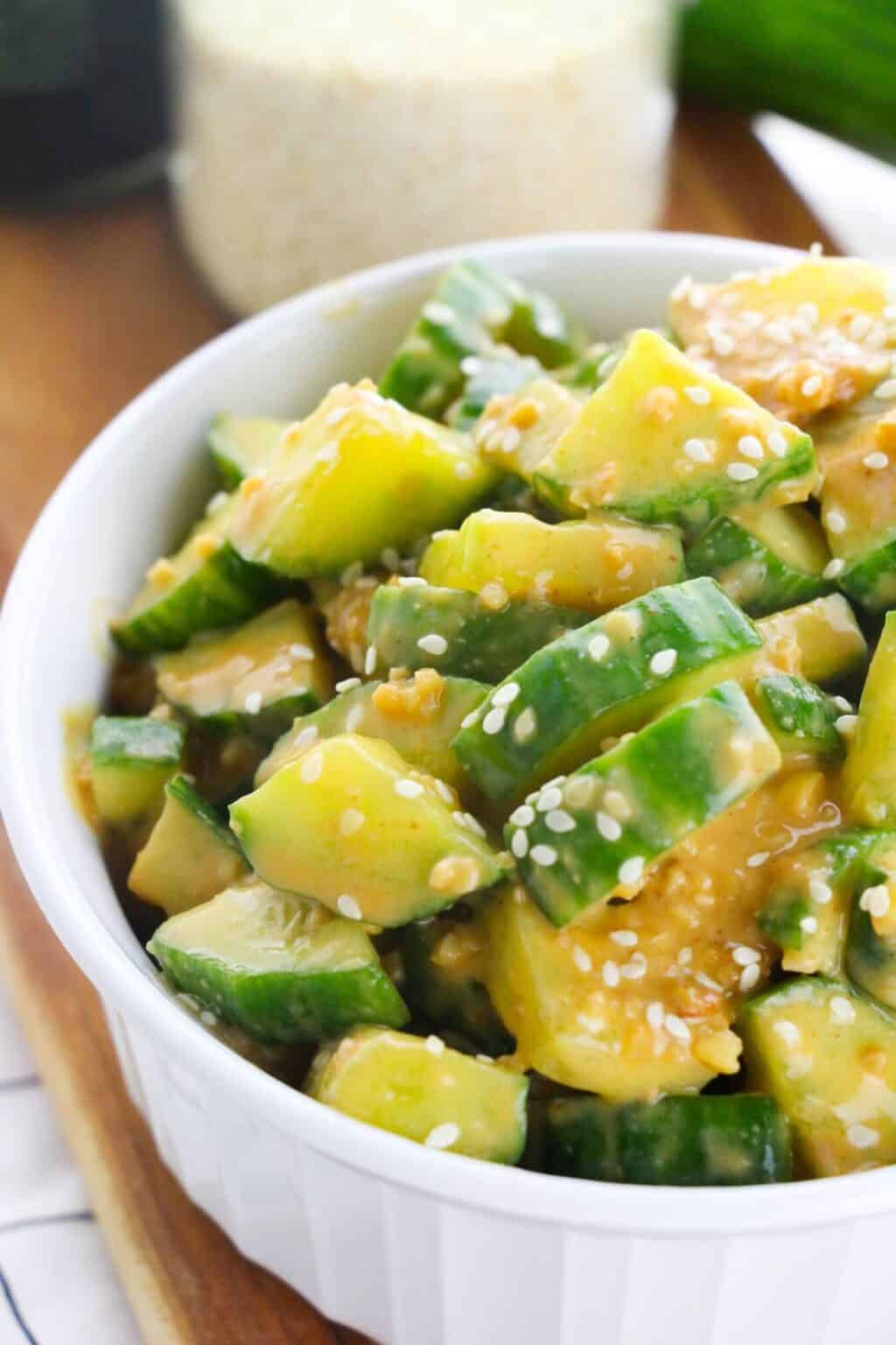 A white dish with the asian spicy cucumber salad.