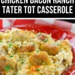 A plate of Chicken Bacon Ranch Tater Tot Casserole is served on a red dish, topped with crispy tater tots and garnished with chopped parsley.