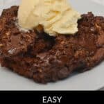 A serving of chocolate cake dump cake topped with a scoop of vanilla ice cream on a white plate, with text reading "Easy Chocolate Dump Cake Only 5 Ingredients.